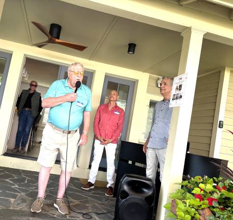 Chairman Jim Pedranti, left, with Javier Morales, Sean Strub, and Bob Levine inside the house in back.