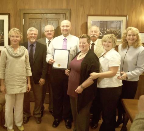 Elisabeth Heij, Matt Osterberg, Karl Wagner, Dave Bever, Betty Ann Teehan, Rich Caridi, Holly Aschoff and Sue Hines gather to “Paint Pike Purple.”