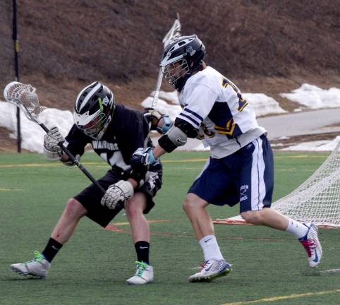 Delaware Valley's Jed Daniel with the ball attempts to break through Vernon's defense.