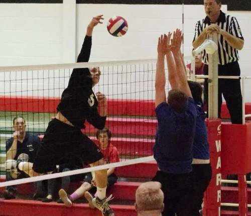 Delaware Valley Warrior Tyler Smith strikes the ball towards Hanover Hawkeyes