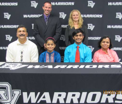 Pictured in front row (from left): Koottala Ramaswamy, Padmiri Ramaswamy (sister), senior Karthik Ramaswamy, and Gauri Ramaswamy. Back row: high school principal Brian Blaum and guidance counselor Jessica Robinson (Photo provided)