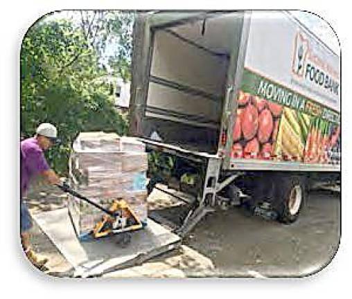 Unloading a delivery from the food bank (Photo provided)