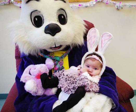 Three-month-old Isabella Eve Lorenzo of Milford visits with the Easter Bunny (Photo by George Leroy Hunter)