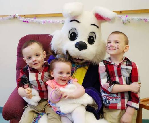 One-and-a-half-year-old Hunter McBride, seven-month-old Madalyn Kunelz, and four-year-old Kagen Kunelz of Dingmans Ferry (Photo by George Leroy Hunter)