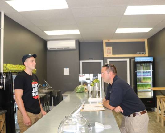 Orange County Executive Steven Neuhaus talks with Adam Schoch, owner of Adam&#x2019;s Juice Bar in Port Jervis (Photo provided)