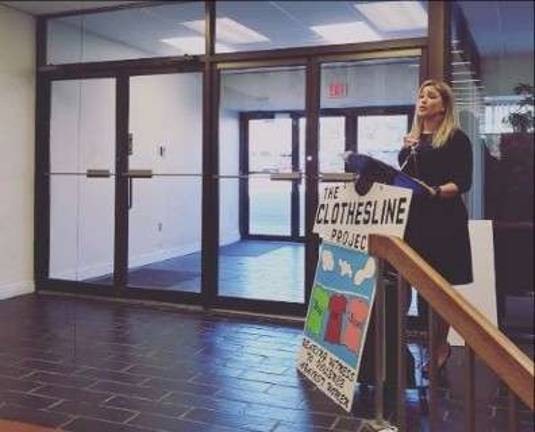 Kellyan Kostyal-Larrier speaks at the opening ceremony and press conference for "The Clothesline Project" on Oct. 2 (Photo provided)