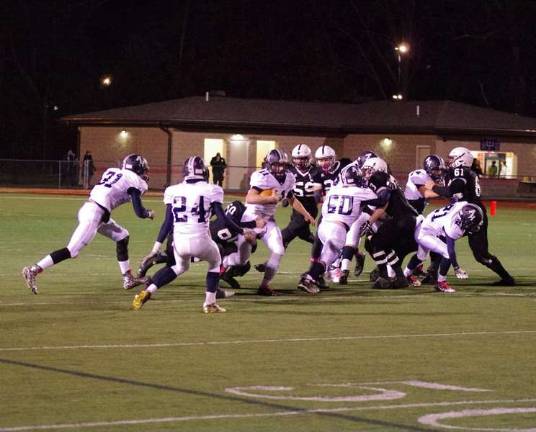 Abington quarterback Colin McCreary (11) attempts to escape the Delaware Valley defense in the first half (Photo by George Leroy Hunter)