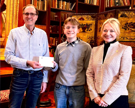 Josh Geller from Minisink Valley High School (center) receives the Pinchot Legacy Scholarship.