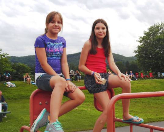 Photos by Anya Tikka Halaina Stefanias and Levi McCollum enjoyed ice cream sitting on the playground equipment.
