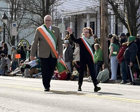 Grand Marshals Larry and Teresa O’Leary wave to the crowd.