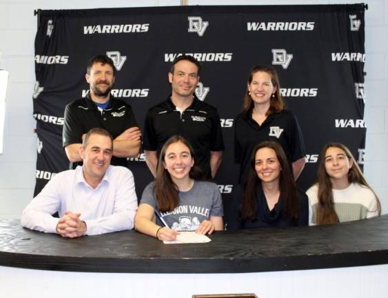 Haley Troup with her parents, Benjamin and Melissa Troup, sister Ava Troup with (l-r, back row) specialist coach Keith Fitzpatrick, assistant coach Justin Roselli and head coach Audrey Dennis.