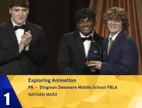 Nathan Marx, representing the Dingman Delaware Middle School FBLA, accept his award in the category for exploring animation.