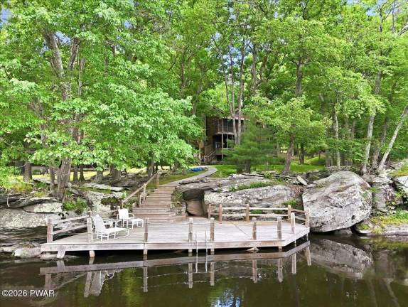 Lakefront luxury with private dock on one-plus acre