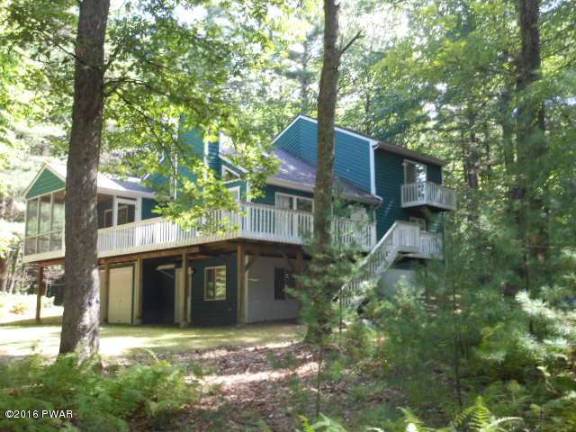 Dingmans home surrounded by trees has lake access