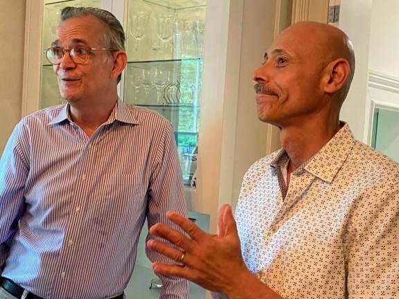 More than 75 excited opera buffs attended a garden party fundraiser at the home of Javier Morales, right, and Sean Strub to show their support for the fourth year of the upcoming Opera! Pike! on Aug. 27.