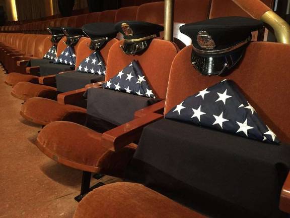 Empty chairs honor fallen police officers at Tuesday's memorial service in Dallas, Texas (Dallas Police Department Facebook photo)