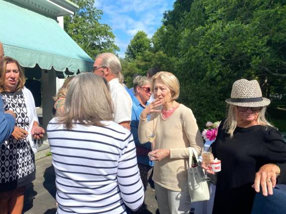Garden party guests await information about the 2024 Milford Writers and Readers Festival.