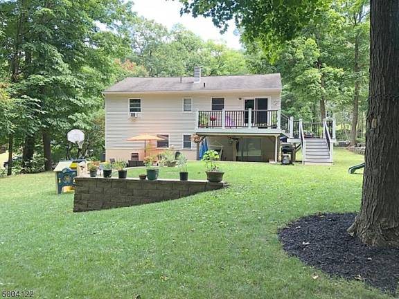 Take your party outside with ease at this renovated bilevel