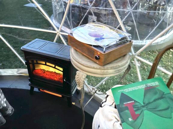 A mini heater and record player keep the igloos cozy.
