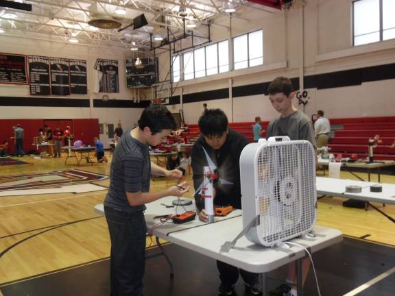 Trial and error: Students work on the competition floor (Photo by Anya Tikka)