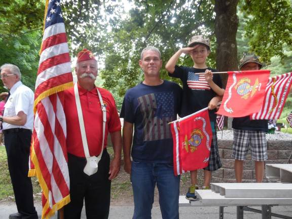 Pike County Commissioner Richard Caridi stands with Matthew and grandson Jackson Castello, and a third grandson.