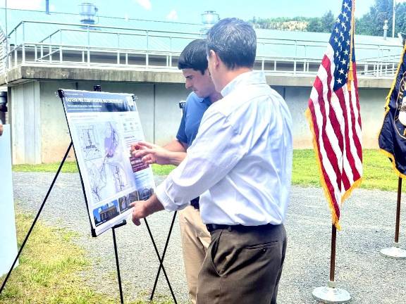 Rep. Bresnahan and Mark Spatz, Westfall Municipal Authority Engineer, go over plans for the sewer extension.