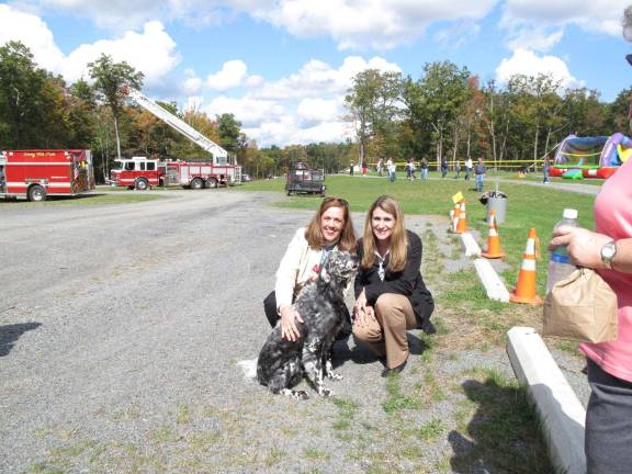 Senator Lisa Baker with her pet dog along with Representative Rosemary Brown during a quiet moment.
