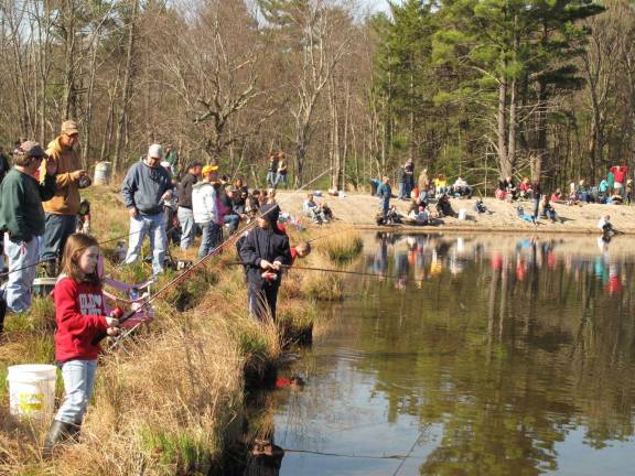 Lily Pond lined with kids fishing on a past Fishing Derby Day (File photo by Jerry Goldberg)