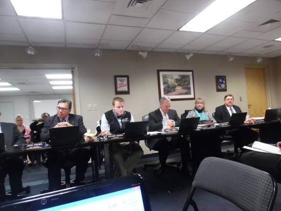Board member Jack Fisher, President Zachary Pearce, Supt. John Bell, board member Pam Lutfy, and board member John Wroblewski (Photo by Anya Tikka)