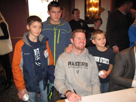Matt McGloin, a former Oakland Raiders quarterback who grew up in Scranton, spent the day signing autographs for a non-stop line of fans. (Photo by Jerry Goldberg)