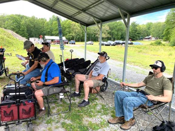 Matamoras Rod and Gun Club shooters await their turn during the Steel Challenge.