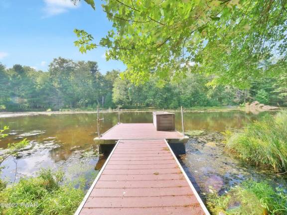 Private lakefront home Is On 3+ acres with Dock