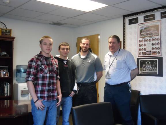 From left: Dominick Divirgilio, Justin Tent, high school principal Brian Blaum, and automotive emissions teacher Mike Dobson (Photo by Anya Tikka)