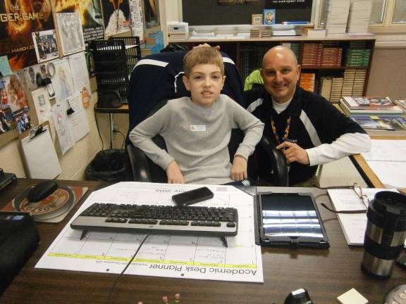 Martin Hastie tries out Dad's desk (Photo provided)