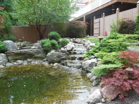 A meditation garden with a waterfall and pond in Forster Hill Road.