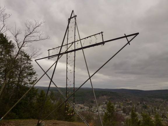 The ornament on Knob, that can be strung with lights to make a cross for Easter, as shown, or to make a Christmas star (Photo by Pamela Chergotis)