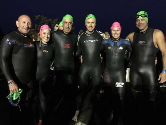 Milford triathletes prepare for the swim portion (from left): Joe Legg, Arielle Lane, Al Valente, Mike Brown, Amy Garrison,and Eric Hutzelmann (Photo provided)