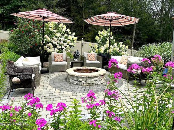 Home on private retreat has pond and waterfalls
