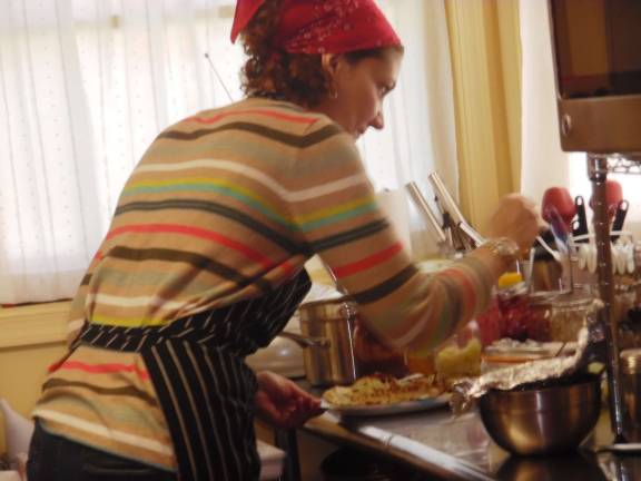 Elizabeth Muller cooks up some crepes.