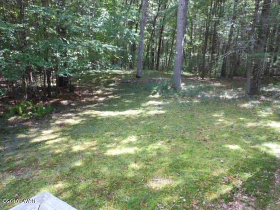 Dingmans home surrounded by trees has lake access