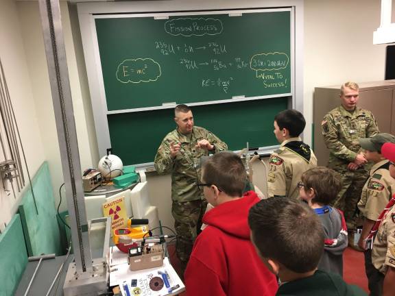 CPT Nathaniel Kaminski explains to a group of Boys Scouts how the particle accelerators work and gives a demonstration (Photo provided)
