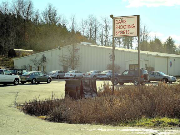 Several cars parked outside Davis Shooting Sports in Goshen, where customers flocked to make gun purchases following a the fatal shooting of 20 children in Newtown, Conn. (Photo by Joshua Rosenau)