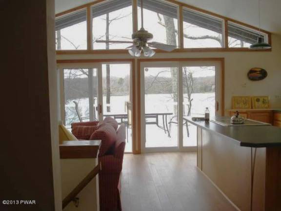 Enjoy the expansive view from this lakefront home