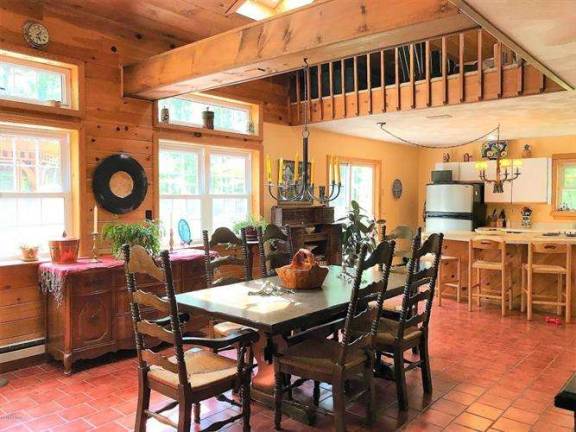 Enjoy woods and water in this two-story country farmhouse