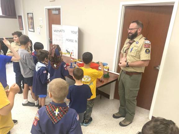 Cubmaster Mike Gillespie with young STEM enthusiasts.