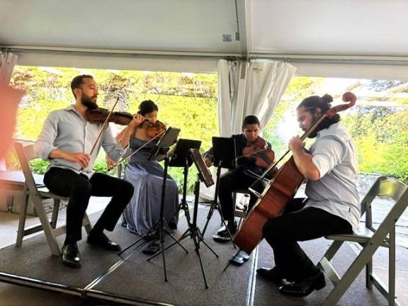 Ivalas Quartet perfoms at the Grey Towers pool pavilion. ( Photo by Marilyn Rosenthal)