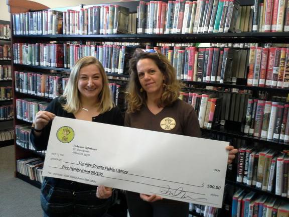 Frisky Goat donates to the library