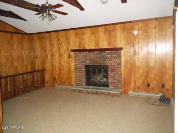 Updated country ranch with lake rights