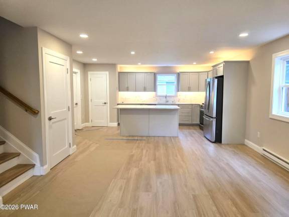 Just built, spacious and move-in ready with three-plus bedrooms
