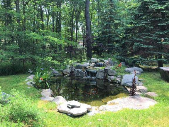 Enjoy woods and water in this two-story country farmhouse